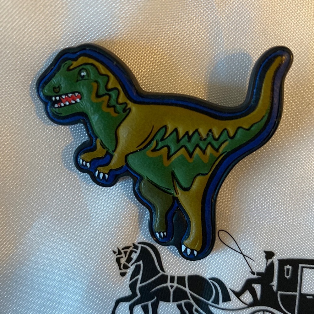 Rare COACH rexy leather pin
